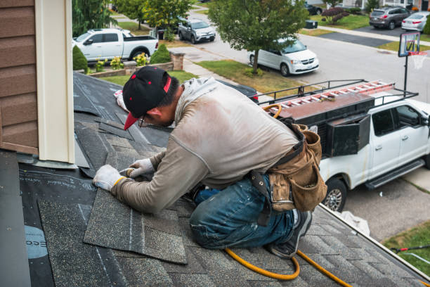 Professional Roofing technician working in Logan, IA